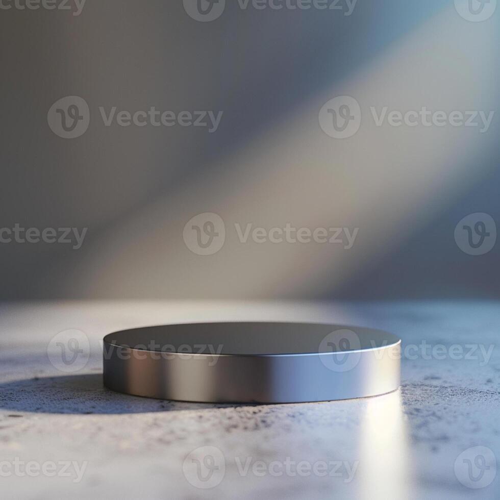A silver object on a table with a light shining on it photo