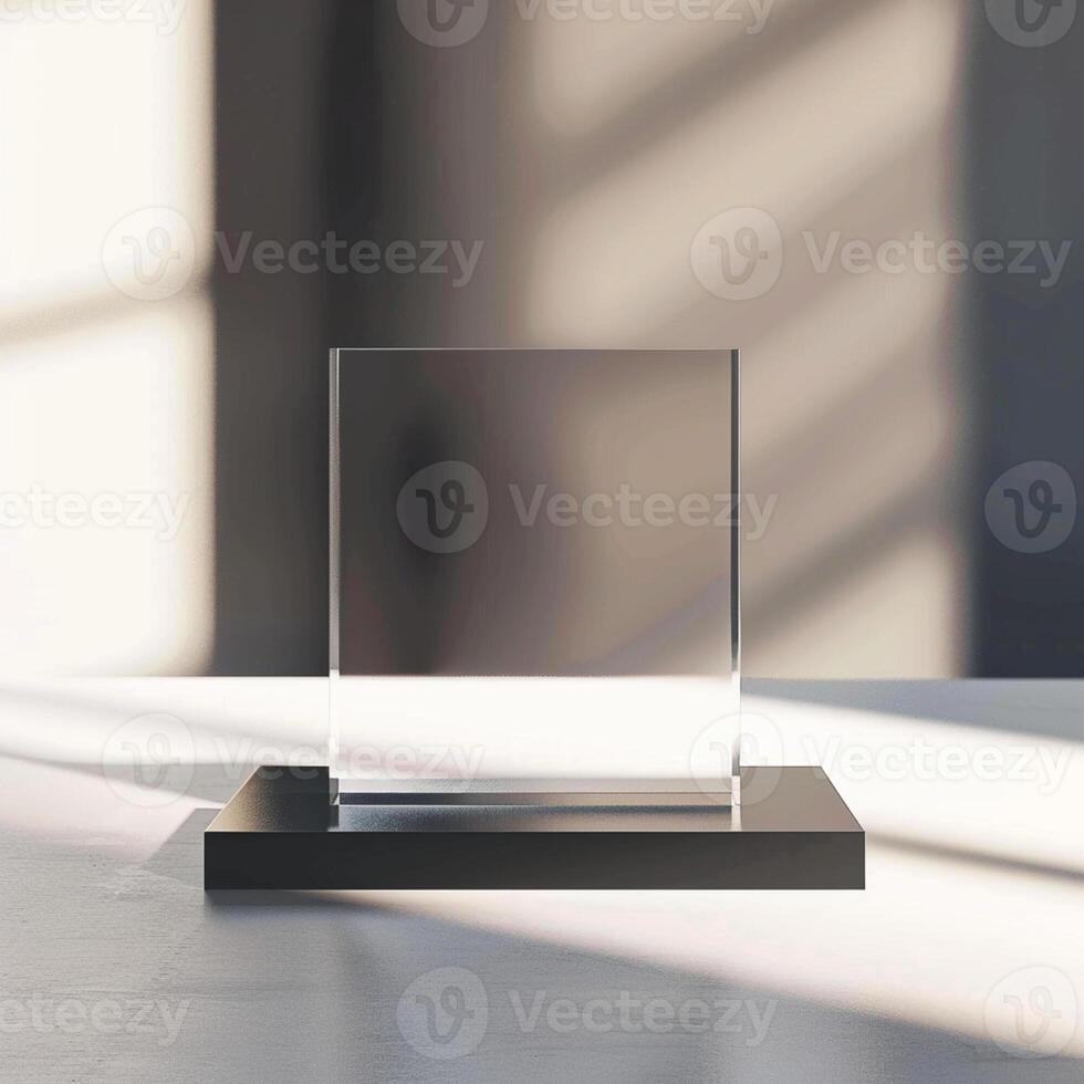 A glass square on a table in front of a window photo