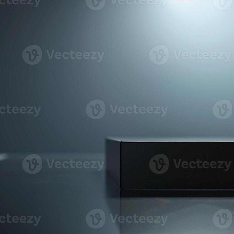 A black box sitting on a table with a light shining on it photo