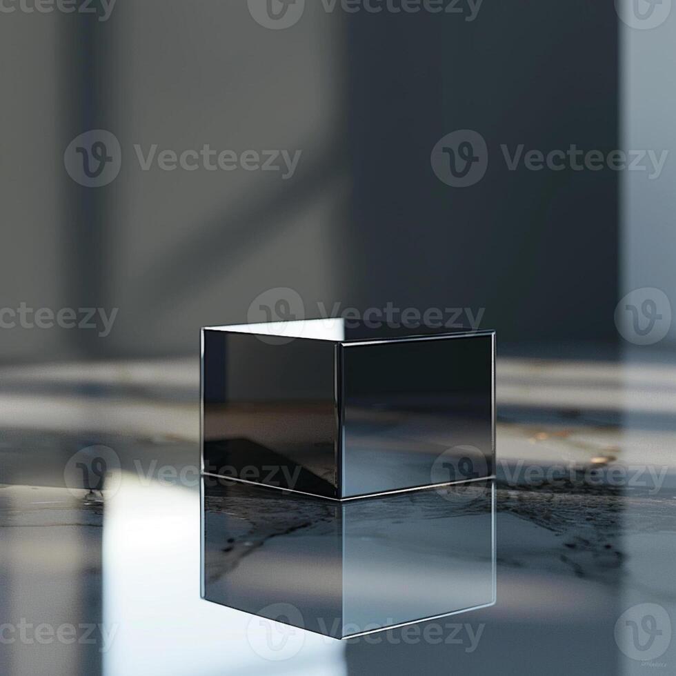 A black cube sitting on a marble surface photo