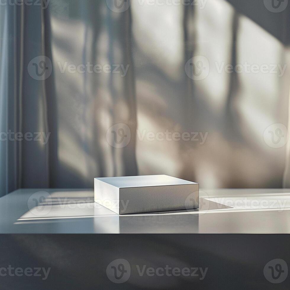 A white box sitting on a table in front of a window photo