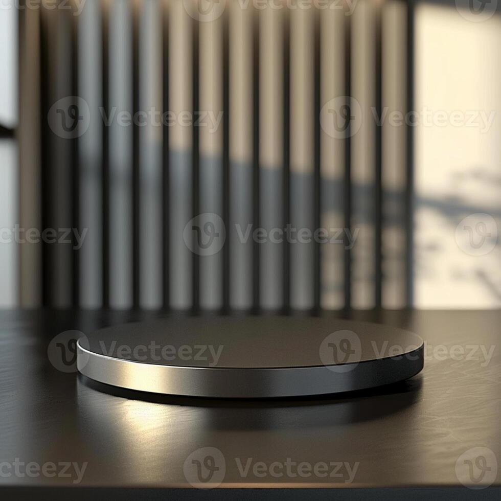 A black round table on a table in front of a window photo