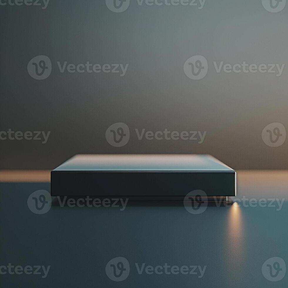 A black box sitting on a table with a light shining on it photo