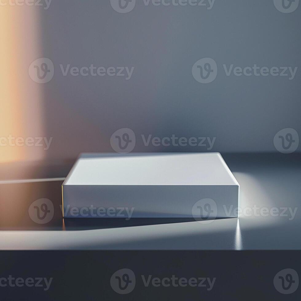 A white box sitting on a table in front of a wall photo