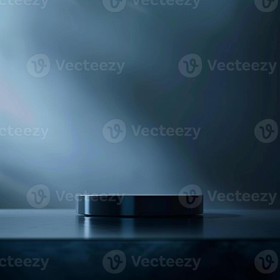 A black object sitting on a table in front of a dark background photo