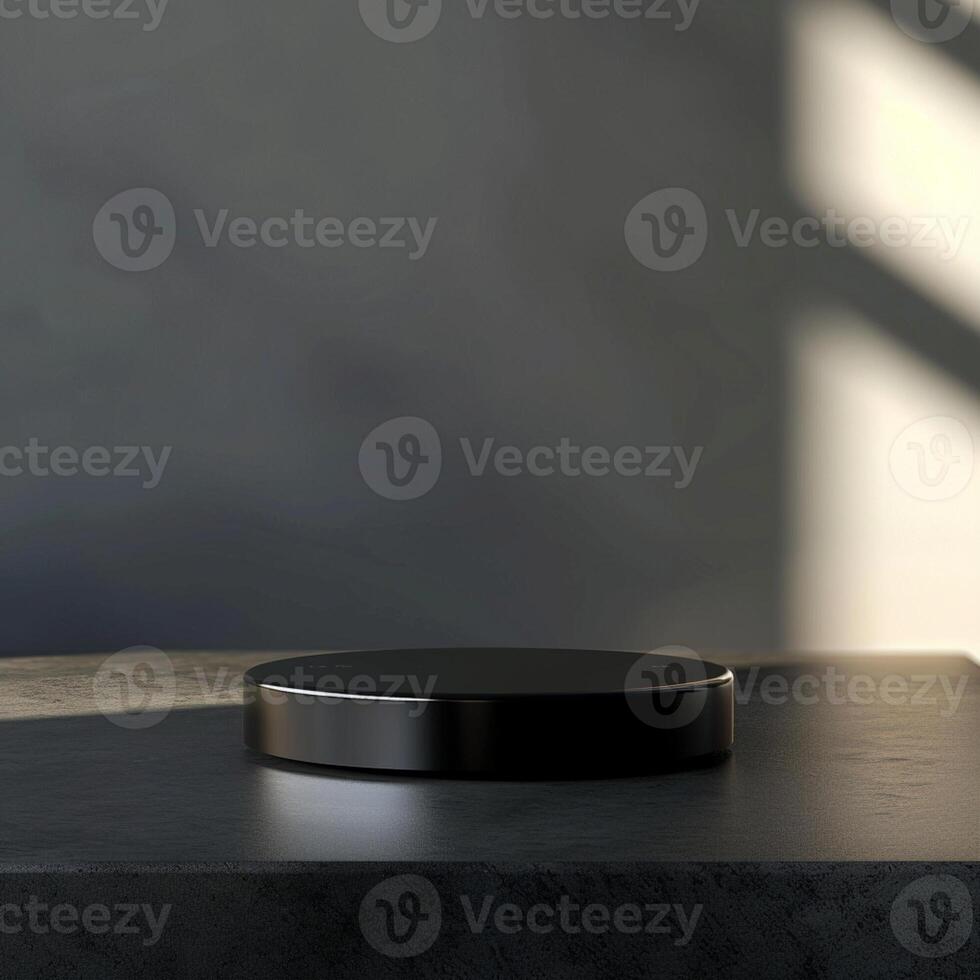 A black object on a table in front of a window photo
