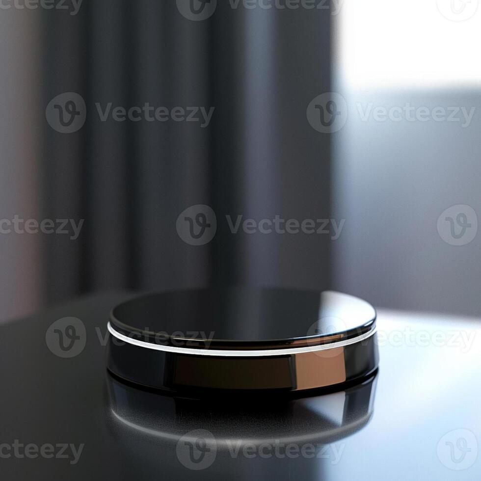 A black object on a table with a window in the background photo