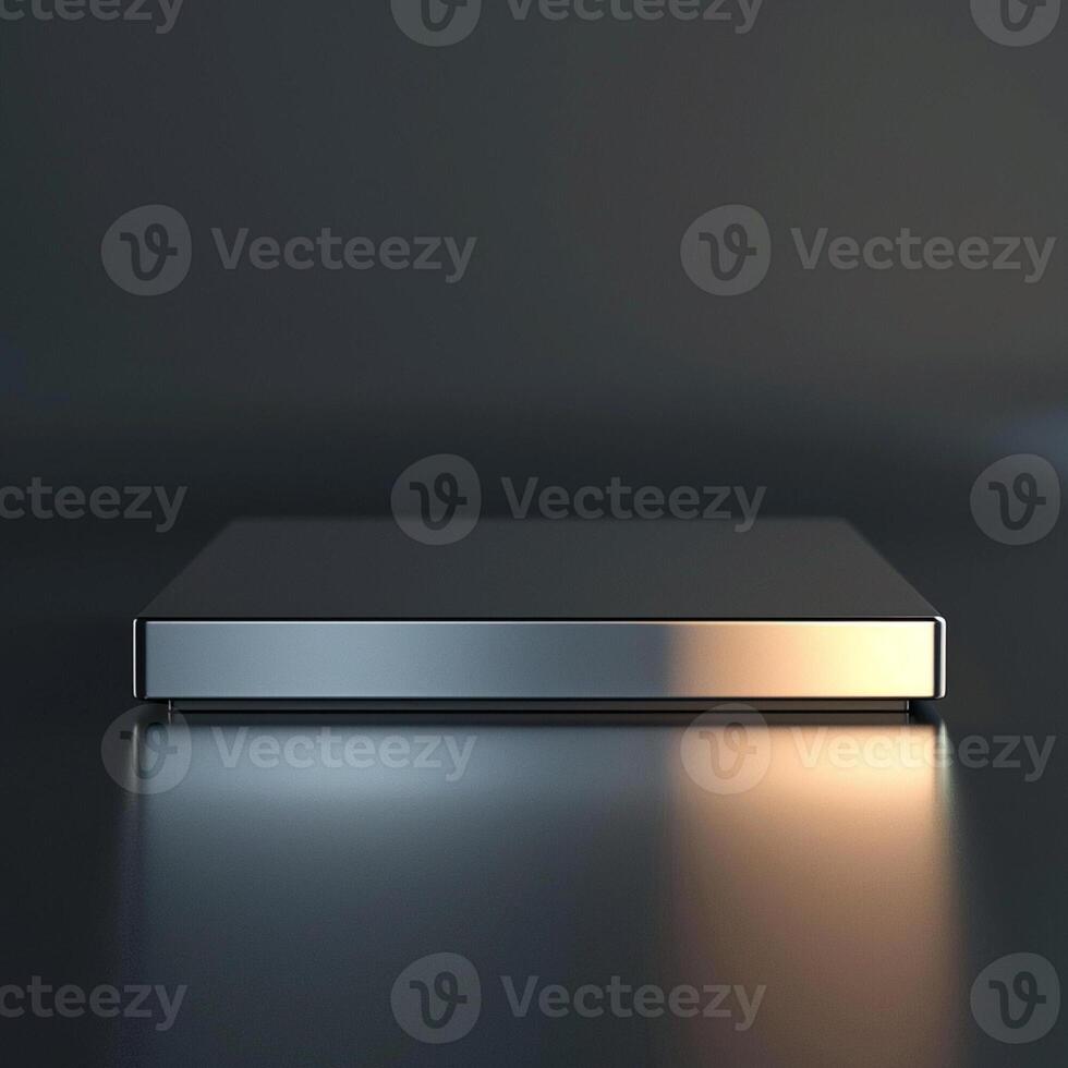 A silver box sitting on a table with a light photo