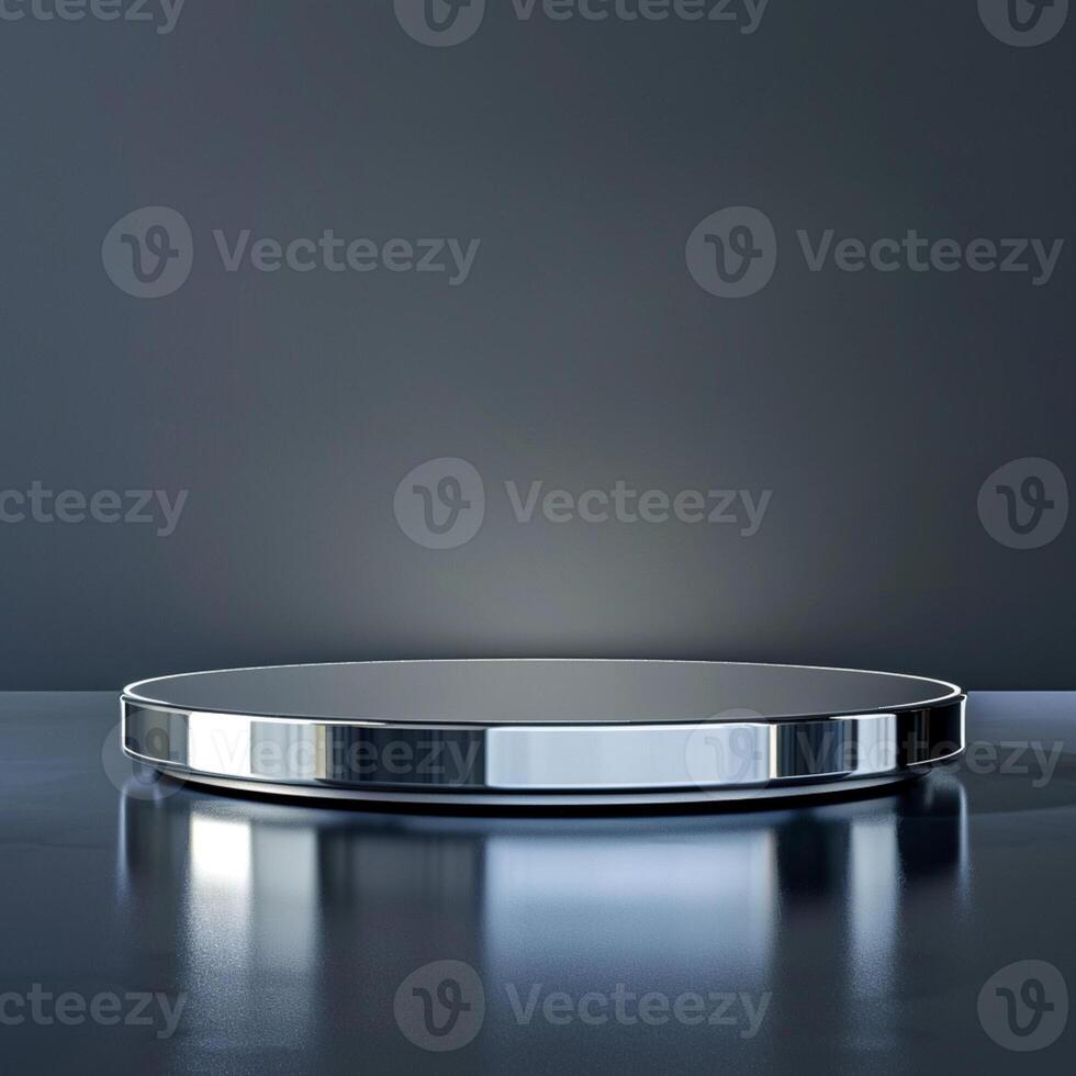 A round table with a silver surface on a dark background photo