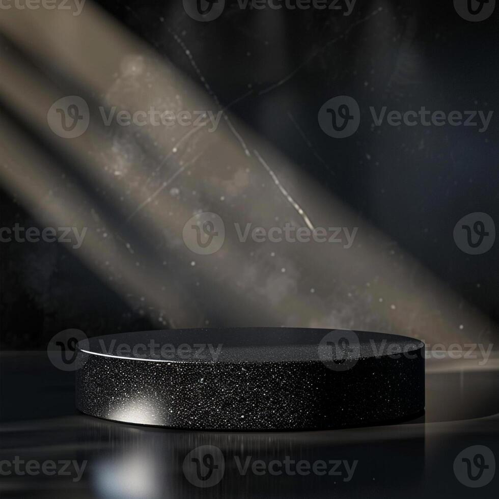 An empty black round table in front of a spotlight photo