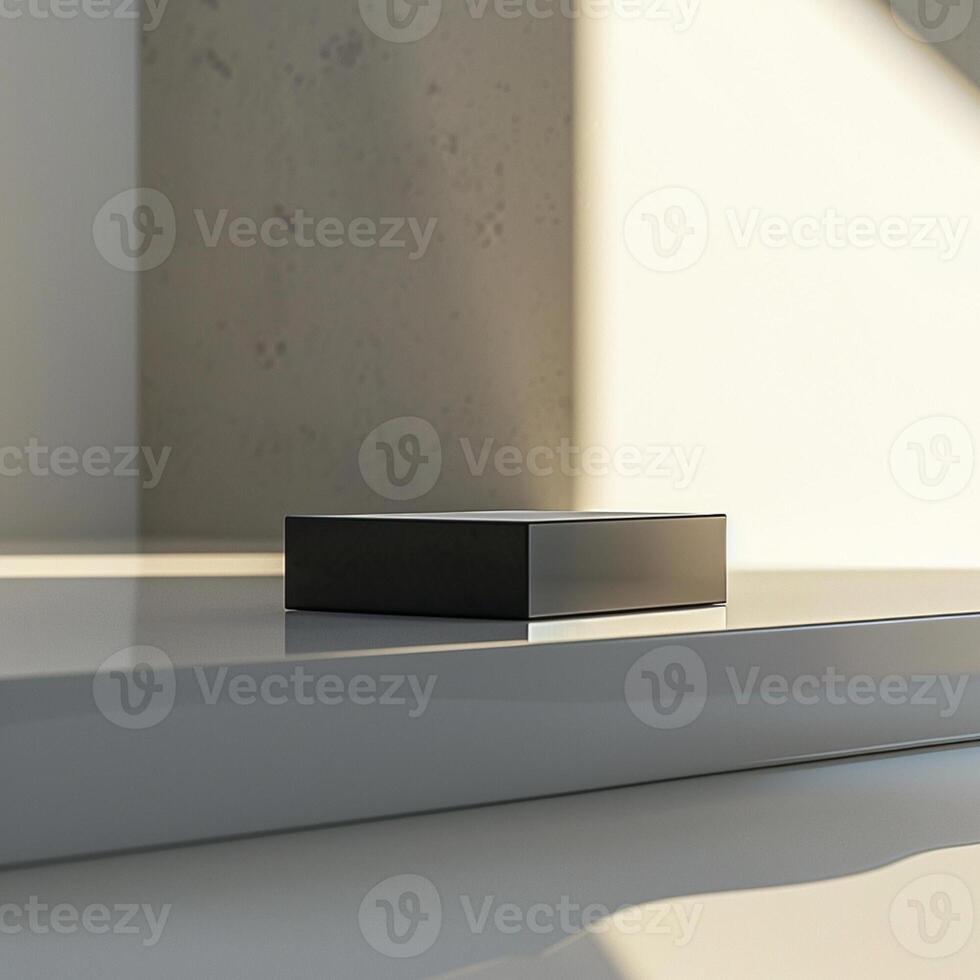 A black box sitting on a table in front of a wall photo