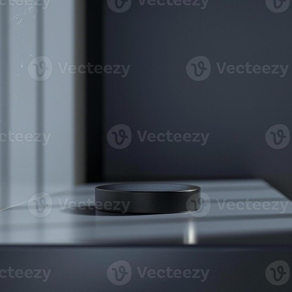 A black ring sitting on a table in front of a window photo