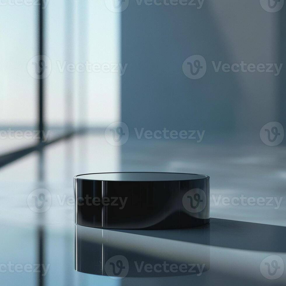 A black round object sitting on a table in front of a large window photo