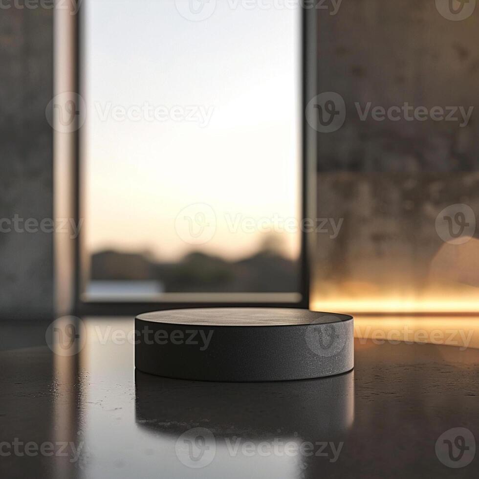 A black box sitting on a table in front of a large window photo