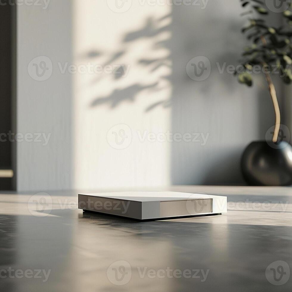 A white box sitting on the floor in front of a plant photo
