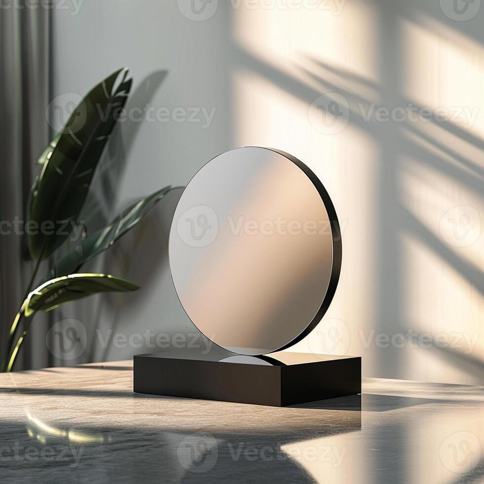 A mirror on a table with a plant in the background photo