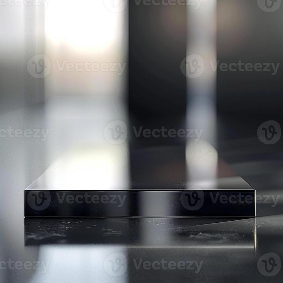 A black square on a table in a dark room photo