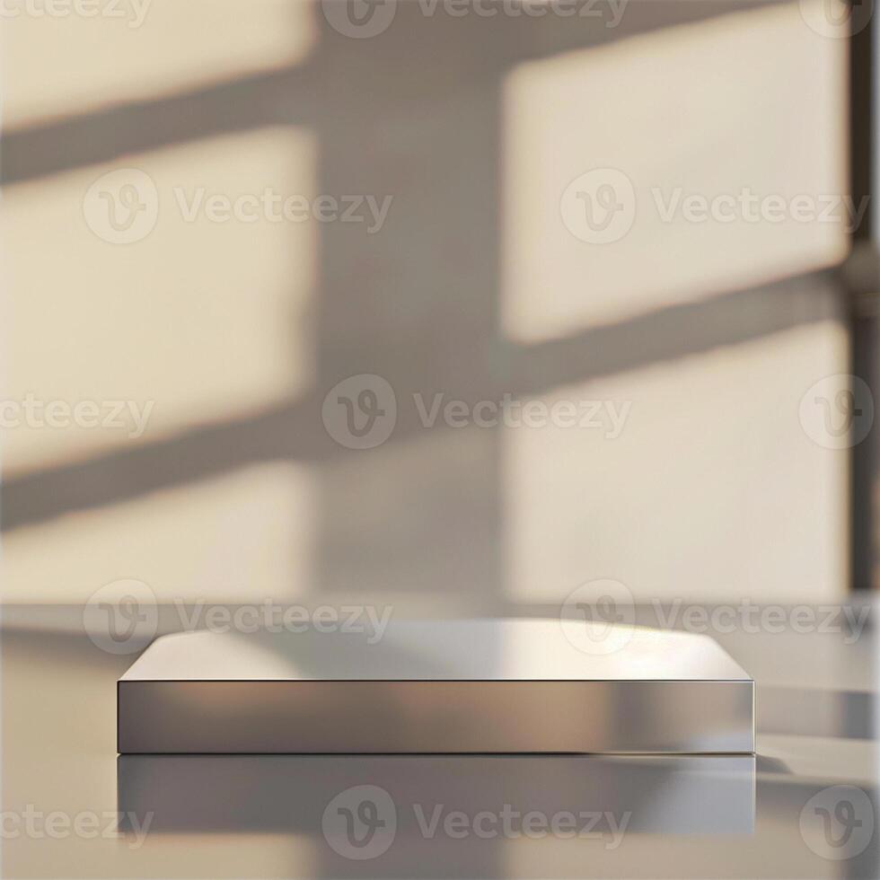 A silver box sitting on a table in front of a window photo