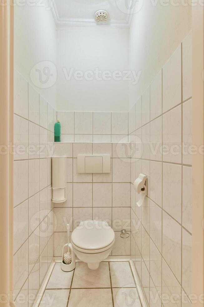 A bathroom with a toilet and a sink photo