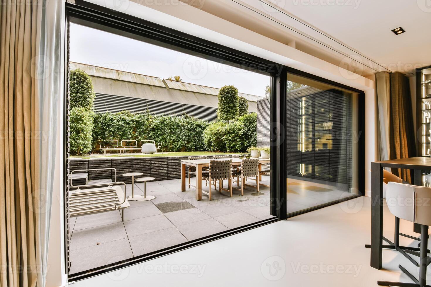 A modern patio with sliding glass doors photo