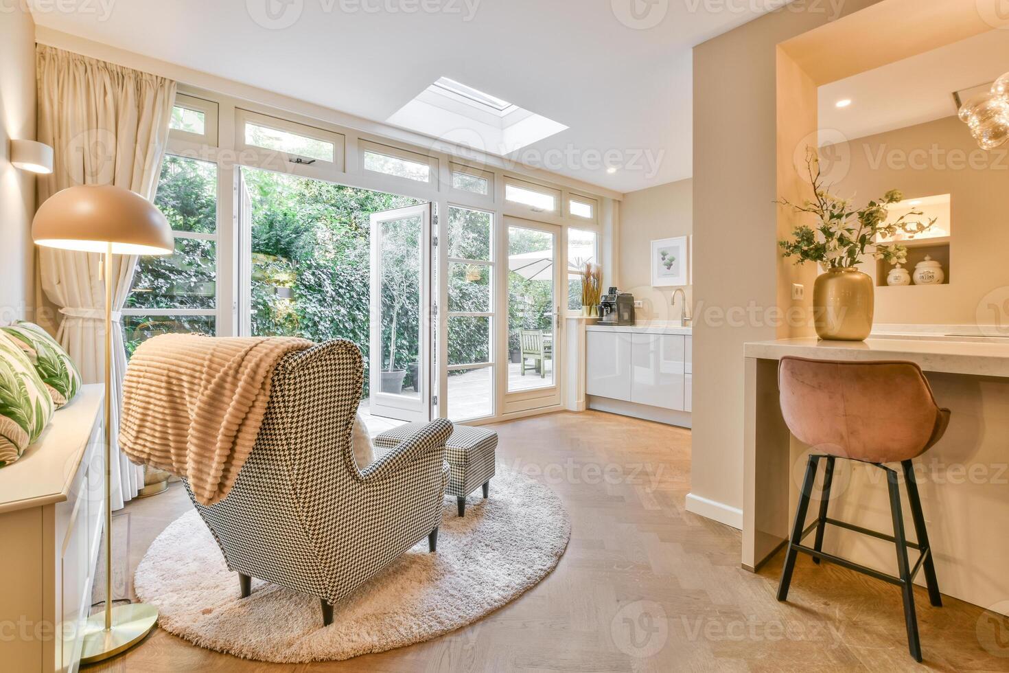 A living room with a chair and a table photo