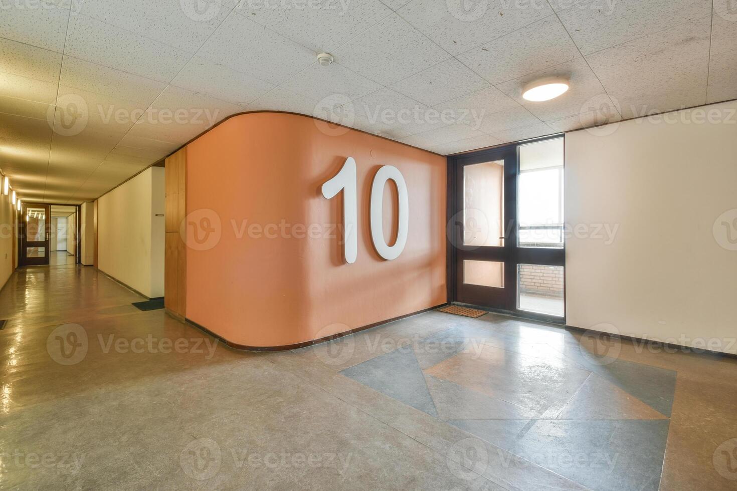 A hallway with a number ten painted on the wall photo