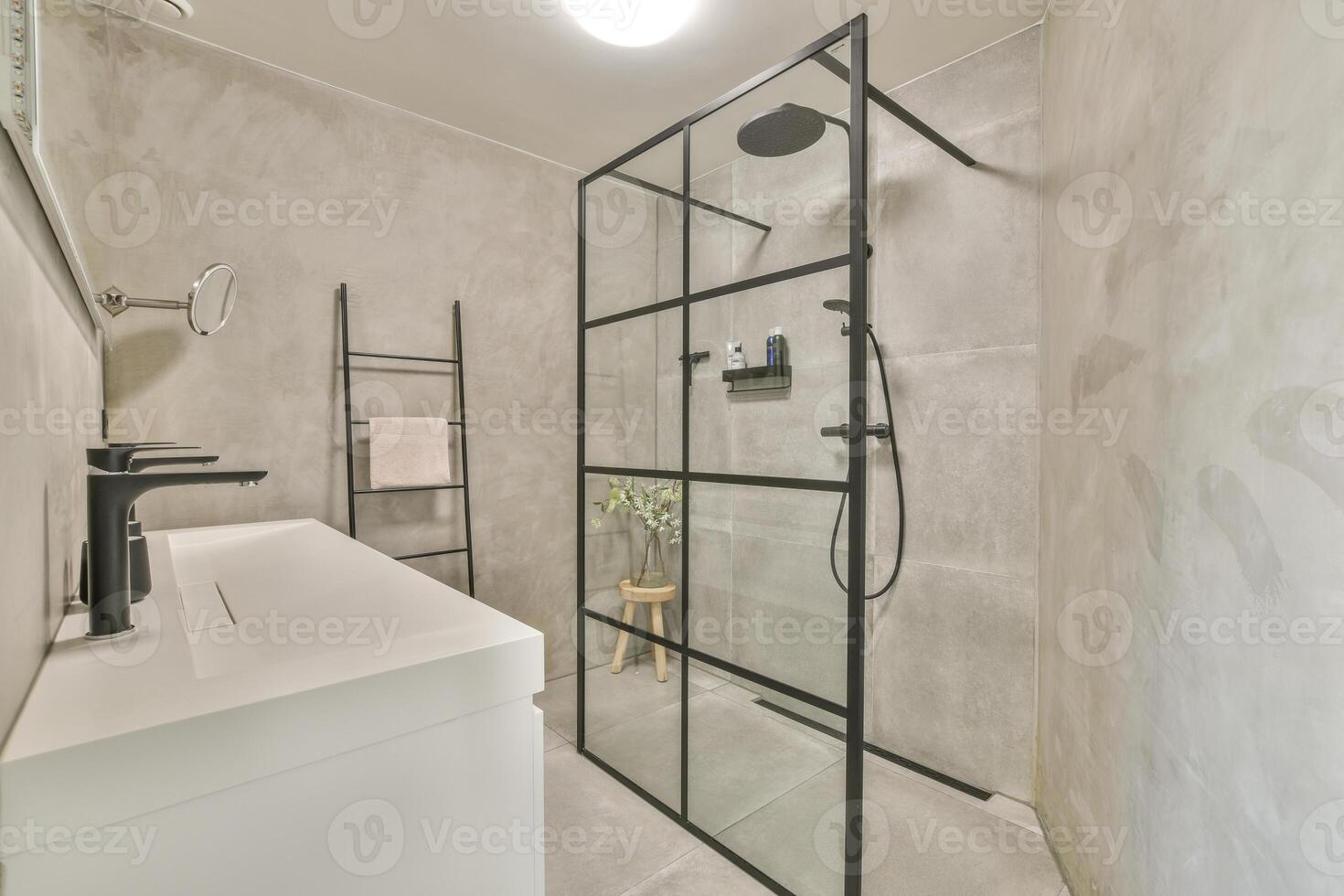 A bathroom with a glass shower stall and a sink photo