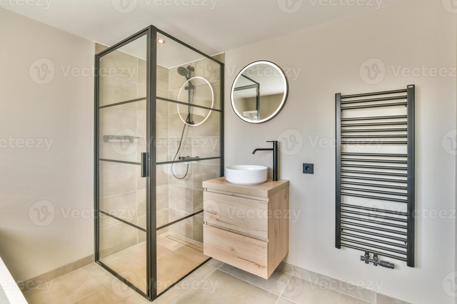 A bathroom with a shower, sink and towel rack photo