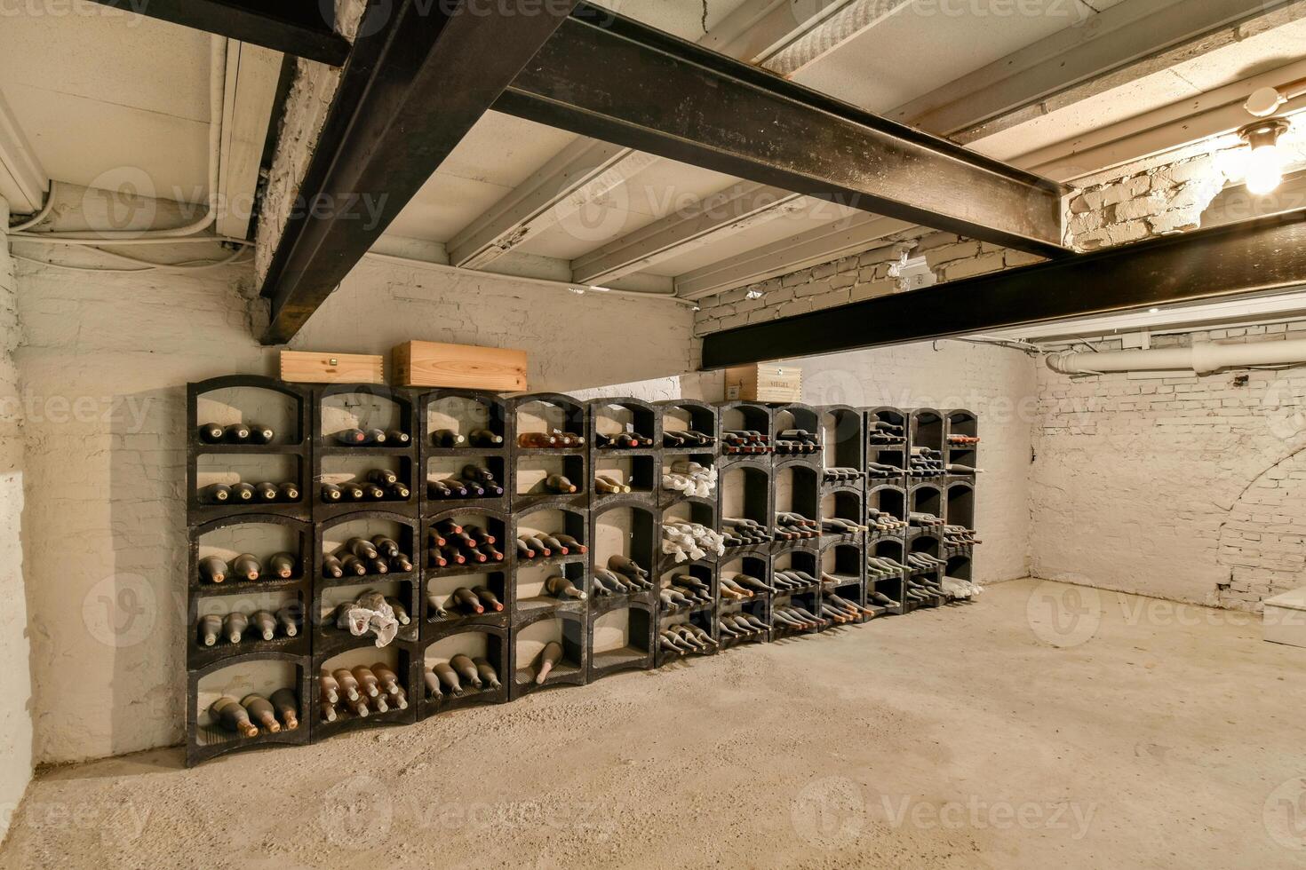 A room with a wine rack and a wall of shelves photo