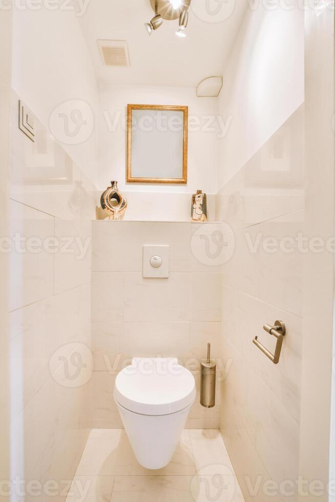 A white toilet in a bathroom photo