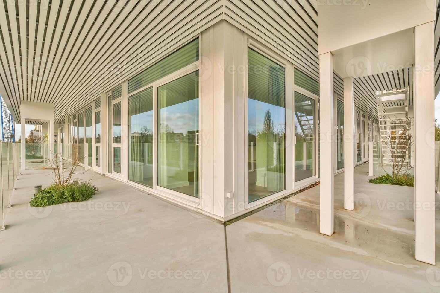 A view of the outside of a building with glass doors photo
