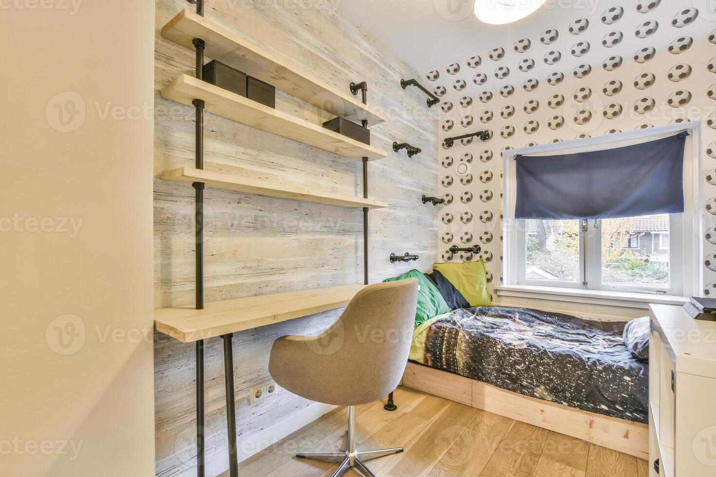A bedroom with a desk and chair photo