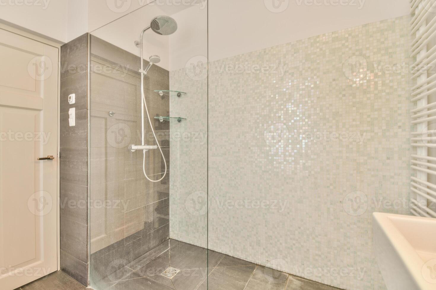A bathroom with a shower and a sink photo