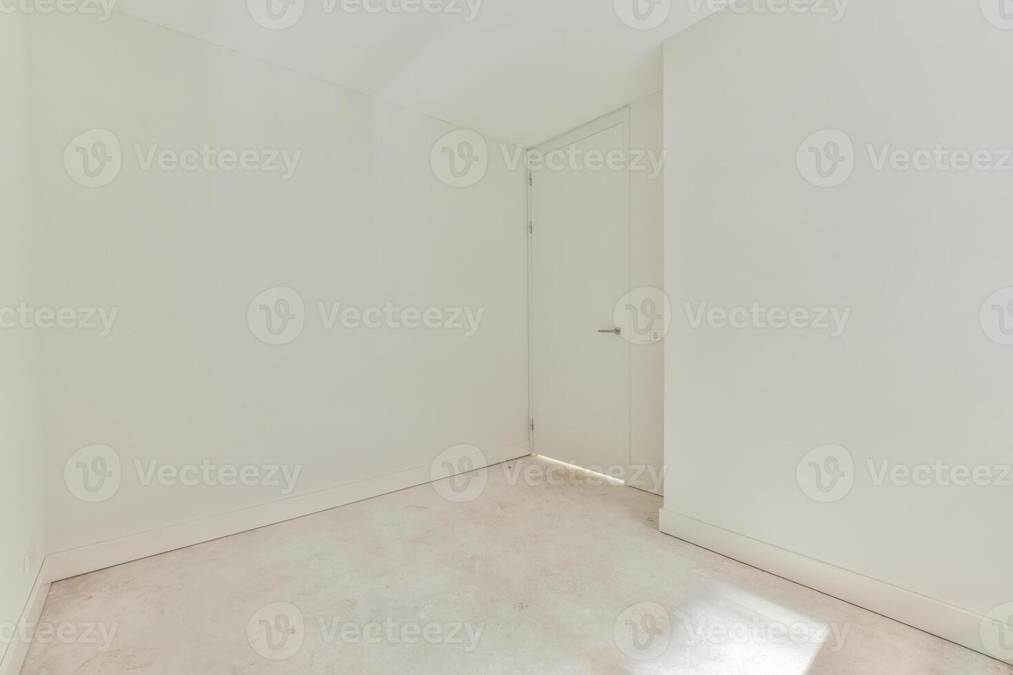 A white room with a door and a white floor photo