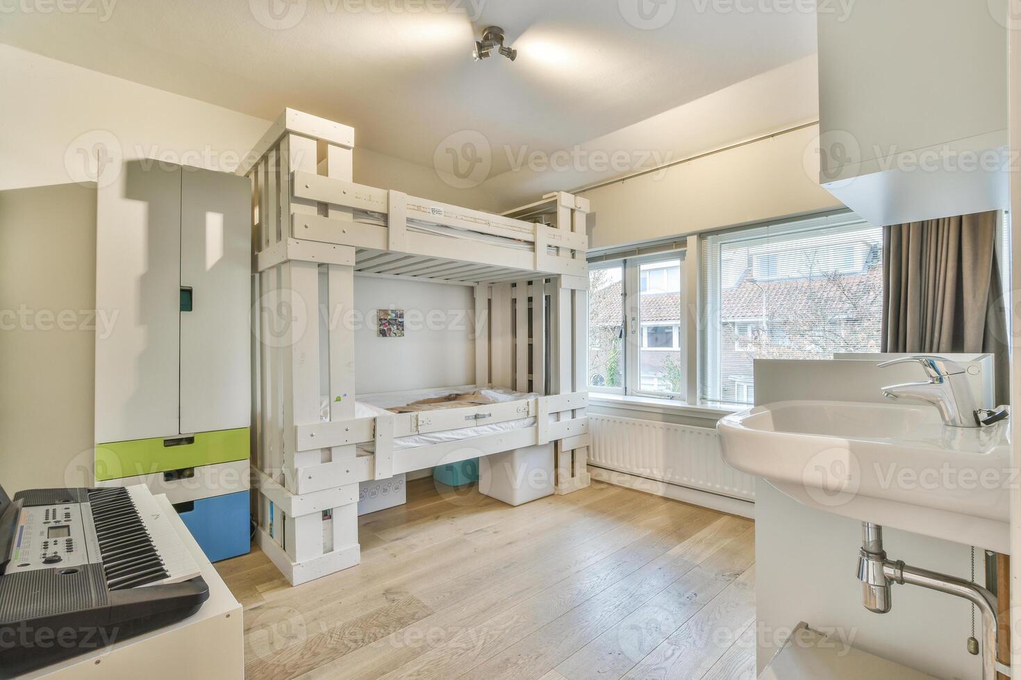 A bedroom with bunk beds and a piano photo