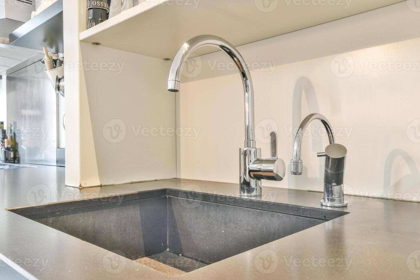 A sink with a faucet and a sink faucet photo