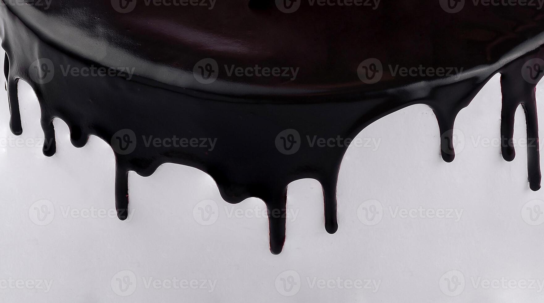 Black icing dripping down white cake minimalist dessert photo