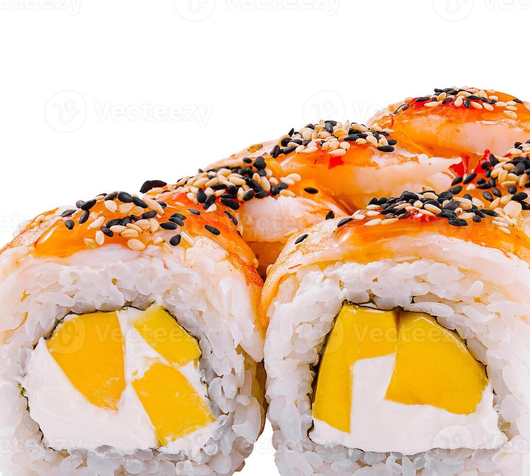 Close-up of uramaki sushi rolls with mango and sesame seeds on top photo