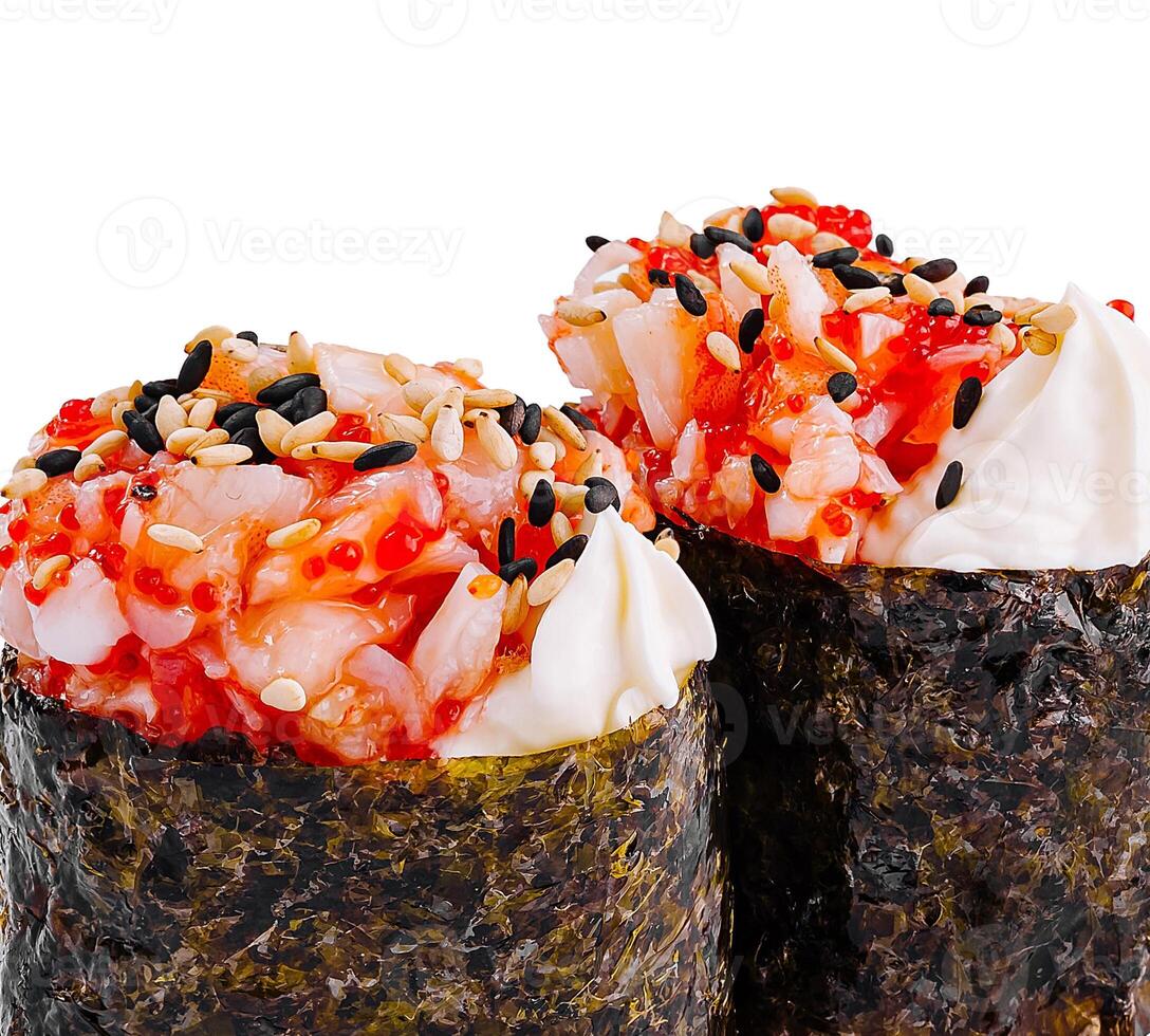 Two gunkan maki sushi rolls with tobiko caviar, sesame and spicy mayo sauce photo