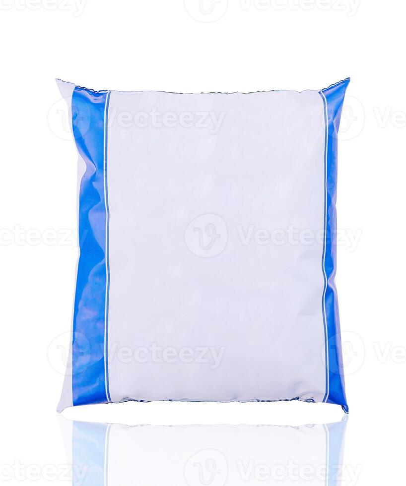 Blank white and blue food package standing up with a reflection photo