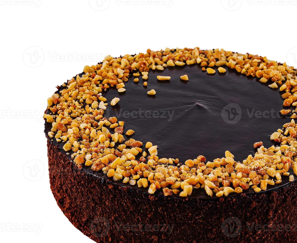 Delicious chocolate cake with chocolate icing and chopped almonds on white background photo