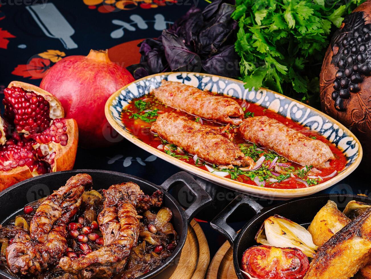Traditional georgian food presenting lamb and various dishes photo