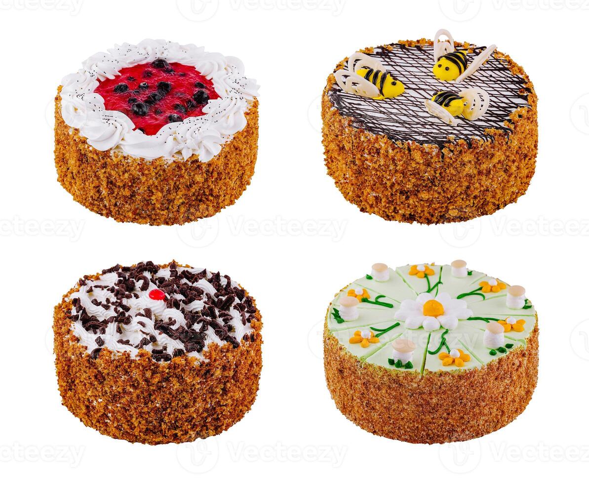 Four delicious round cakes standing on white background photo