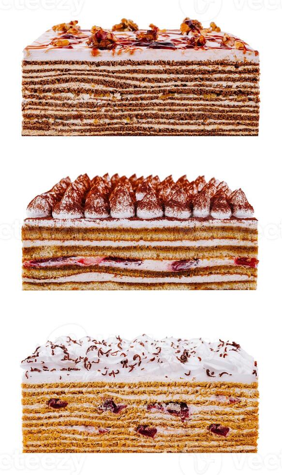 Three different cake slices showing filling and frosting on white background photo