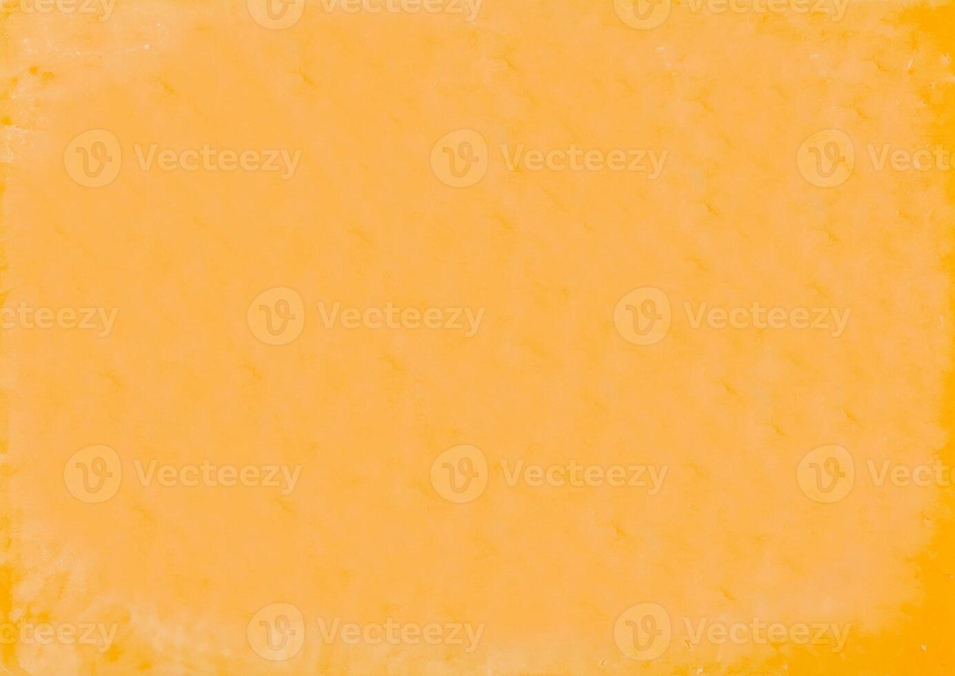 Vacuum packed block of cheddar cheese close up background photo