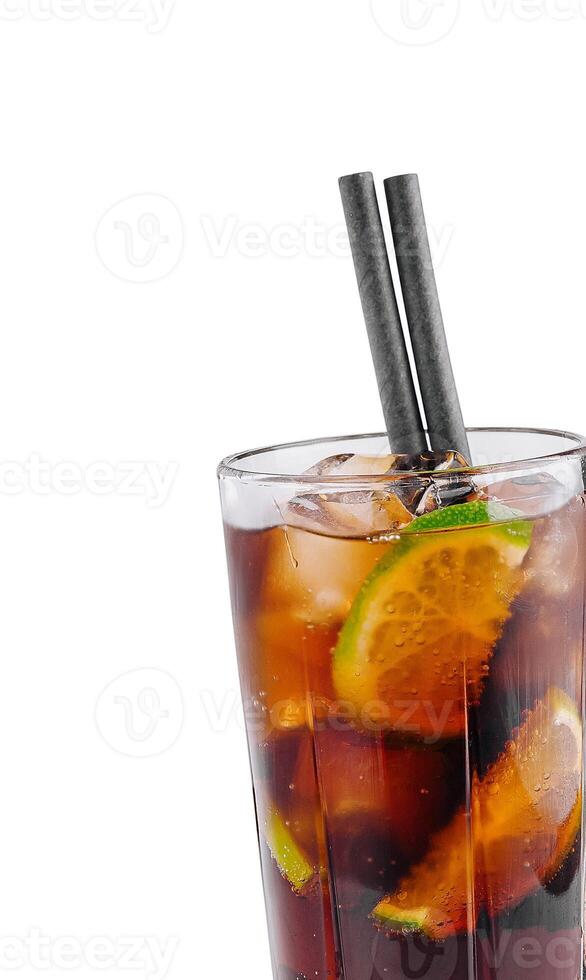 Cocktail with lime slices and ice cubes is standing on white background photo