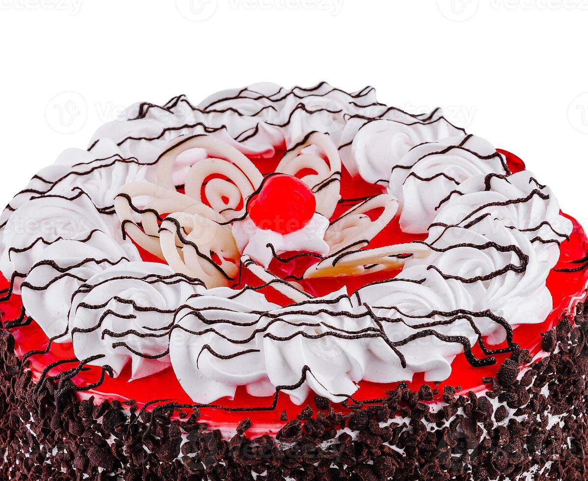 This delicious cake is decorated with frosting and a cherry on top photo