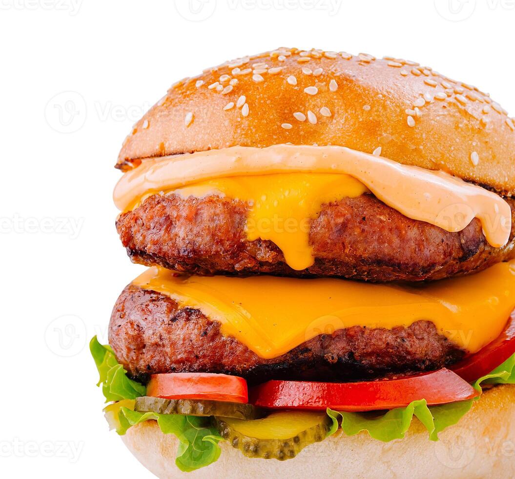Delicious burger with melted cheese and vegetables on white background photo