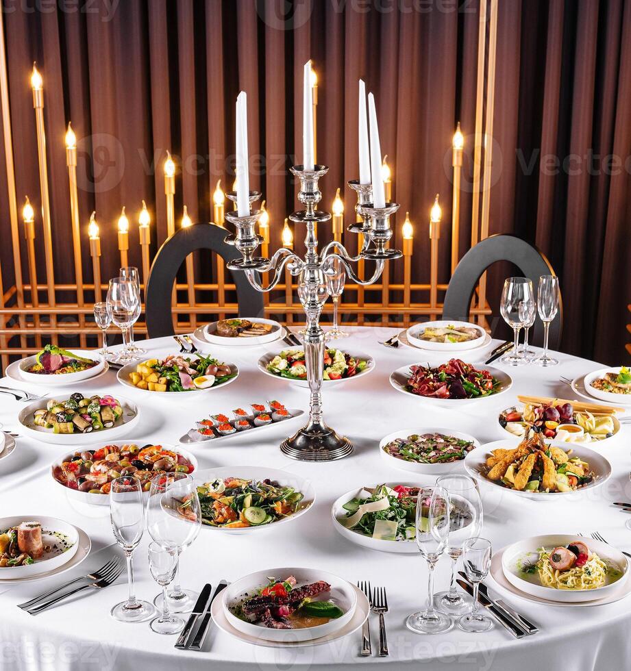 Elegant banquet table setting with gourmet cuisine photo