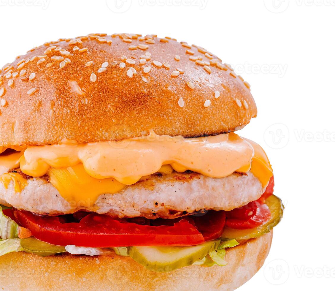 Delicious burger with chicken patty, vegetables and sauce on white background photo